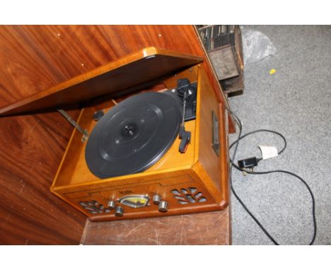 AN ITEK COMBINATION RECORD PLAYER AND RADIO