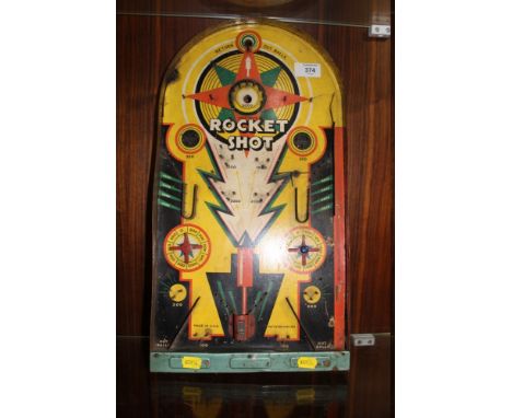 A VINTAGE WOOD AND METAL AMERICAN BAGATELLE GAME 'LINDSTOMS ROCKET SHOT'