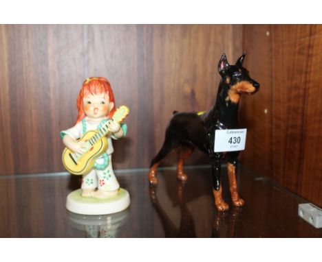 A ROYAL DOULTON CH.RANCHO DOBE'S STORM DOBERMANN FIGURE TOGETHER WITH A GOEBEL SWINGER FIGURE (3)