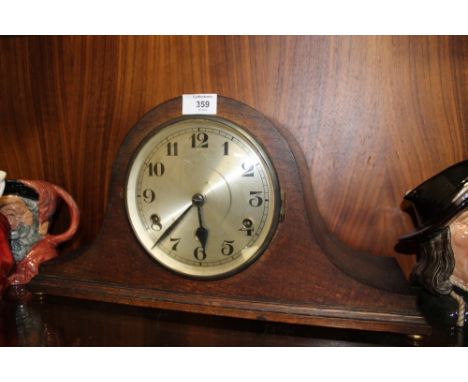 AN OAK NAPOLEON HAT MANTEL CLOCK