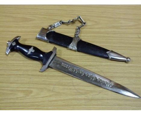 A REPRODUCTION NAZI DAGGER WITH SCABBARD AND HANGER