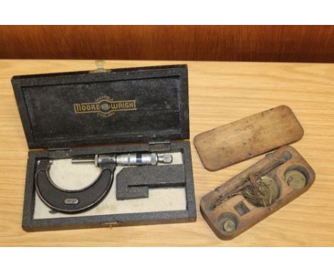 A BOXED SET OF GOLD SCALES TOGETHER WITH A BOXED MEASURING INSTRUMENT