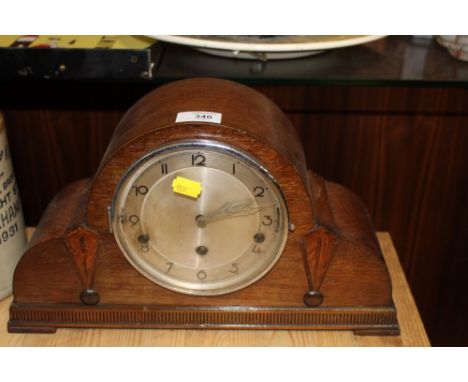 AN ART DECO OAK MANTEL CLOCK