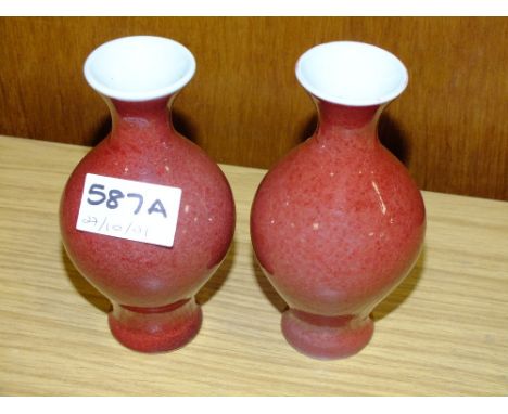 A PAIR OF SMALL SANG DE BOUEF STYLE ORIENTAL CERAMIC VASES - HEIGHT 13CM