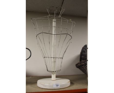 A WIREWORK TORSO MANNEQUIN ON STAND