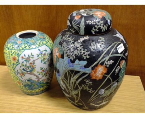 A VERY LARGE ORIENTAL GINGER JAR DECORATED WITH BIRDS AND FLOWERS ON BLACK GROUND TOGETHER WITH A LARGE ORIENTAL CERAMIC VASE