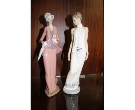 TWO LARGE NAO FIGURES, OF A LADY HOLDING A KITTEN AND A LADY IN A WHITE DRESS