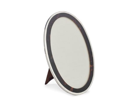 A silver-mounted tortoiseshell photograph frameSanders &amp; Mackenzie, Birmingham 1918Oval form with silver mount and wooden