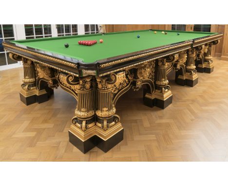 A late Victorian Renaissance revival ebonised oak and parcel gilt snooker/billiards table by Waring and Gillow, together with