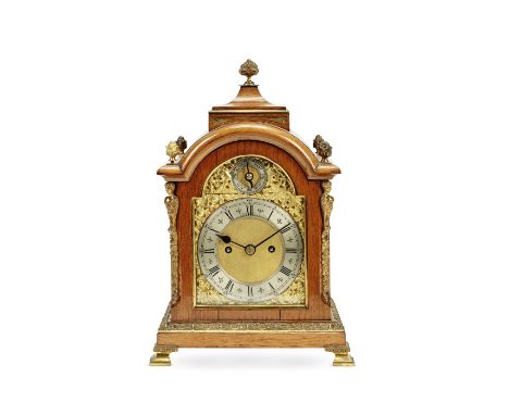 An early 20th century gilt brass mounted oak table clockin the George III styleof arched rectangular form, the swept square t