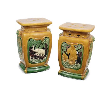 A pair of Chinese egg and spinach glazed ceramic garden seatsin the Tang Dynasty styleof rounded rectangular baluster form, t
