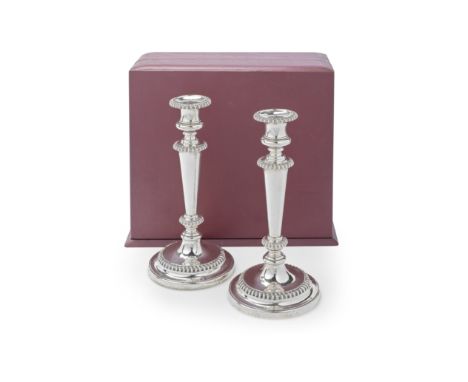 A pair of George III silver candlesticks, later casedJohn &amp; Thomas Settle, Sheffield 1819, one removable drip pan Sheffie