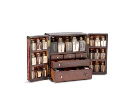 A Large Mahogany Apothecary Chest, English, Mid-19th century,with recessed brass carrying handle, the double doors opening to