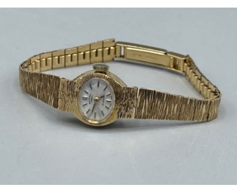 Ladies 9ct gold Rotary watch with tree bark affect. 15.7g