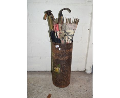 METAL STICK STAND WITH PAINTED FLORAL DECORATION CONTAINING AN ASSORTMENT OF VARIOUS PARASOLS, WALKING STICKS ETC