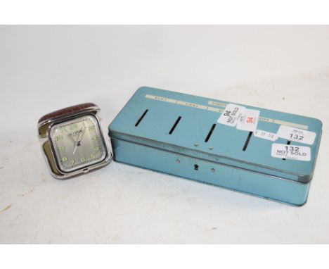 METAL MONEY BOX AND A TRAVELLING ALARM CLOCK
