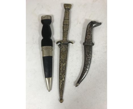 A DECORATIVE 'DOGS HEAD' KNIFE IN NIELLO SCABBARD AND TWO OTHERS. A short dagger with 'dogs head' handle and allover niello d