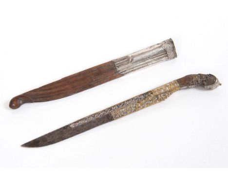 CEYLON SINHALESE PIHA KAETTA DAGGER &amp; SCABBARD probably 19thc, with a wooden and white metal hilt, the blade elaborately 