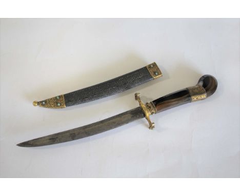 EASTERN DAGGER possibly Ottoman, with an agate hilt and brass mounts and mounted with small turquoise stones. With a curved d