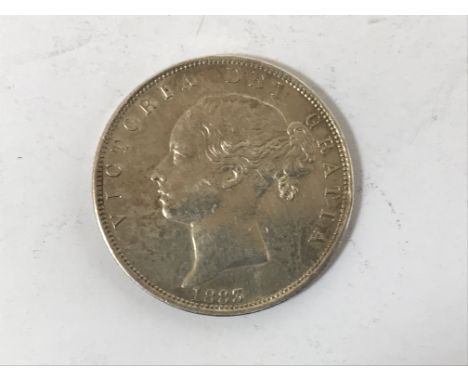 A VICTORIAN HALFCROWN. A Victorian Halfcrown, young head portrait, dated 1883. 