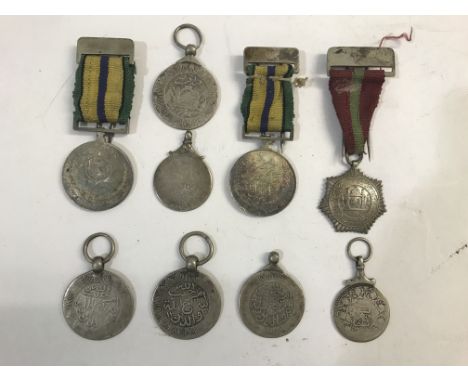 AN INTERESTING COLLECTION OF NINE INDIAN MEDALS/AWARDS. A collection of nine awards or similar possibly Inidian States, six p