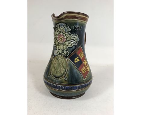 A DOULTON LAMBETH 'FLAG OF PRETORIA' JUG. A Doulton Lambeth stoneware jug dated June 5th 1900 with a portrait of Queen Victor