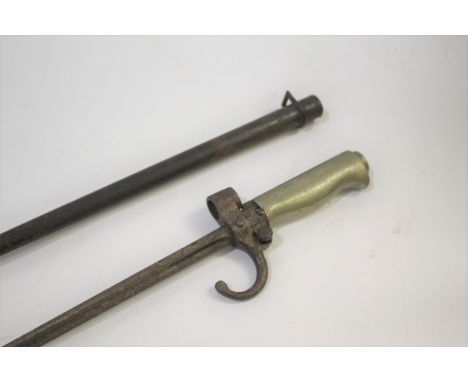 WW1 FRENCH BAYONET a WW1 lebel bayonet, with an alloy grip, forward swept quillon and steel scabbard. Blade 52cms long