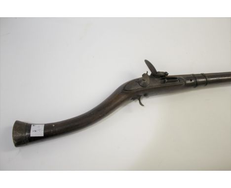 EASTERN FLINTLOCK LONG GUN a Jezail type decorator long gun, with brass barrel bands and flintlock mechanism (cock broken). G