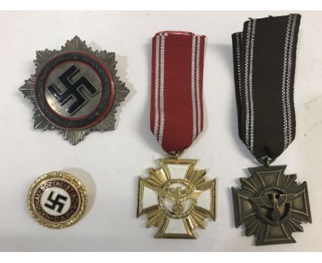 A GROUP OF GERMAN MEDALS AND BADGES. A National Socialist German Workers Party style Long Service Cross and similar gilt and 