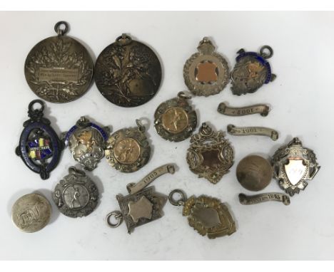 A FAMILY GROUP OF EDWARDIAN AND LATER SPORTING MEDALS. Sporting medals awarded to Walter and Isabel Dampier, two named to Wal