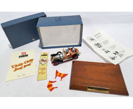 Corgi "Chitty Chitty Bang Bang", a boxed model comes with wooden plinth 25th anniversary 1967-1992 and booklet. Conditions ge