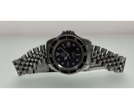 A Tag Heuer stainless steel 1000 professional 200m divers style quartz watch with date complication on original bracelet work