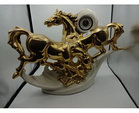 Italian ceramic horse figure with inbuilt mechanical clock, (50 x 40)cm