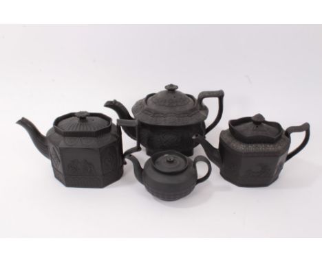 Four early 19th century black basalt teapots including gothic architectural designs (4)