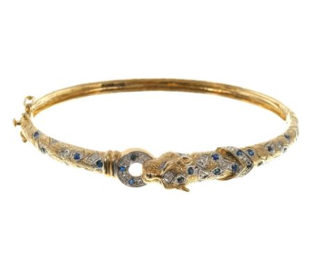 Sapphire and diamond hinged bangle modelled as a leopard in 9ct gold setting.