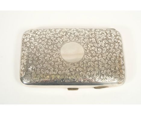 Edwardian silver cigar case of shaped, rectangular cushion form, with engraved foliate decoration, vacant cartouche and silve