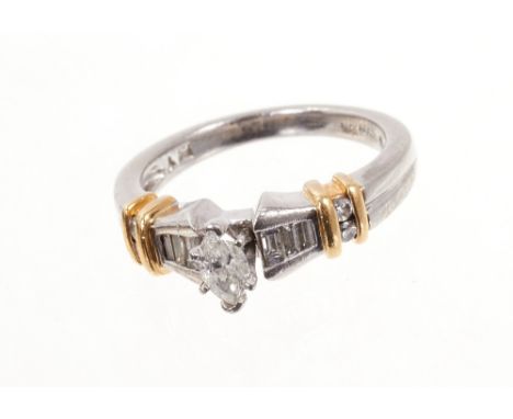 Diamond and platinum ring with a marquise cut diamond estimated to weigh approximately 0.25cts, flanked by graduated baguette