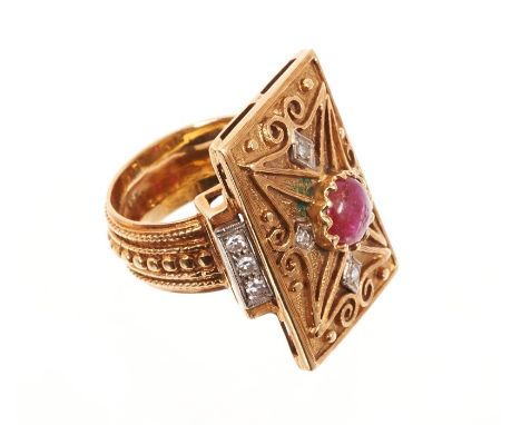 Eastern gold dress ring, the rectangular plaque with a central cabochon ruby and single cut diamonds, on beaded shank. Finger