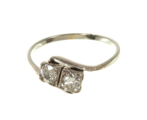 Diamond two-stone ring with two old cut diamonds estimated to weigh approximately 0.50cts in total, in crossover setting. Fin