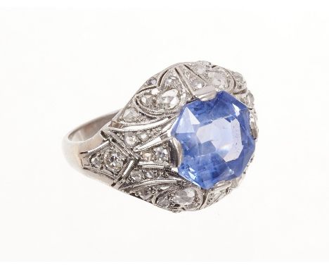 Art Deco sapphire and diamond ring with an octagonal facet cut cornflower blue sapphire measuring approximately 10.55mm x 9.7