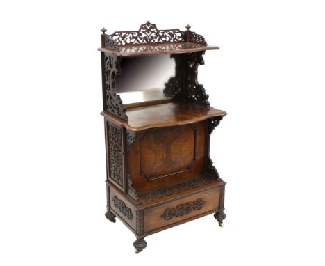 Mid 19th century figured walnut whatnot, with pierced gallery shelf and mirror back tier, enclosed by fret carved door to eac