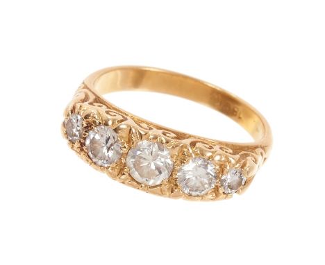 Victorian style diamond five stone ring with five graduated brilliant cut diamonds in carved gold setting on gold shank. Esti