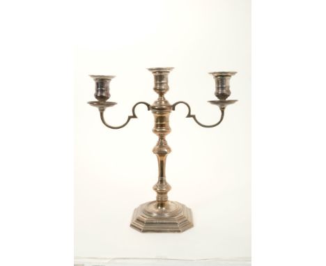 Contemporary silver three light candelabrum of octagonal form, with knopped stem and twin branches with inverted bell candle 
