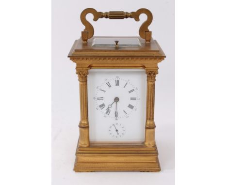 Victorian repeating alarm carriage clock with enamel dial, gilt metal case with Corinthian column mounts and swing handle 20c