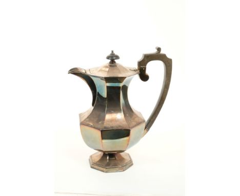 1920s silver hot water jug of faceted baluster form, with angular fruit wood handle, hinged domed and faceted cover, with tur