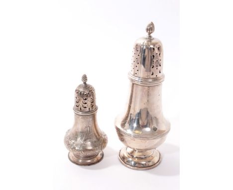 Victorian silver caster of baluster form with chased and engraved floral decoration and pierced slip in cover. (London 1856) 