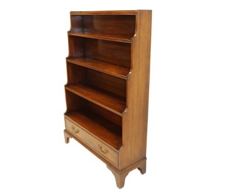 Regency mahogany waterfall bookcase, with four graduated shelves and drawer below on bracket feet, 92cm wide x 32cm deep x 13