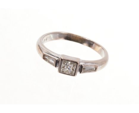 18ct white gold diamond ring with a princess cut diamond estimated to weigh approximately 0.40ct, flanked by tapered baguette