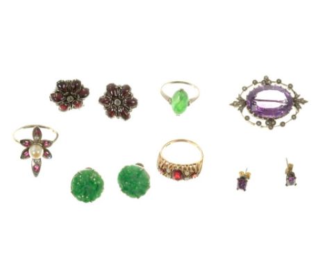 Group of jewellery to include an amethyst brooch, pair of cabochon garnet and diamond earrings, pair of Chinese carved green 