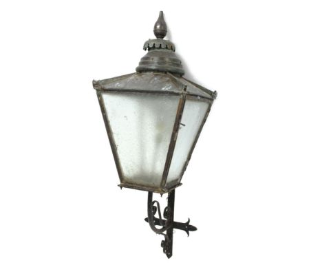 Early 20th century street lantern, of tapering square form with finialed domed copper cover and four glass sides, raised on s